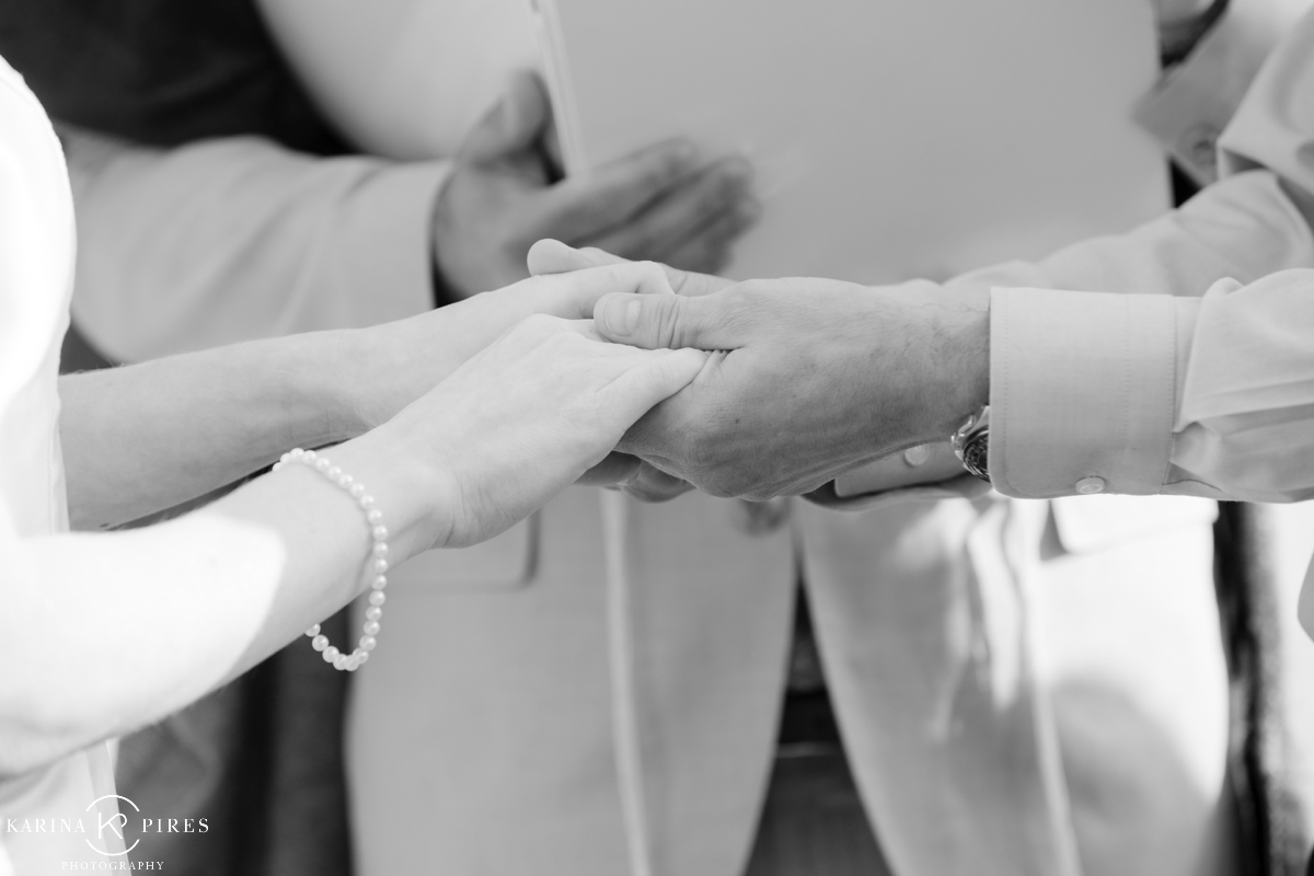 Couple holding hands at their wedding ceremony