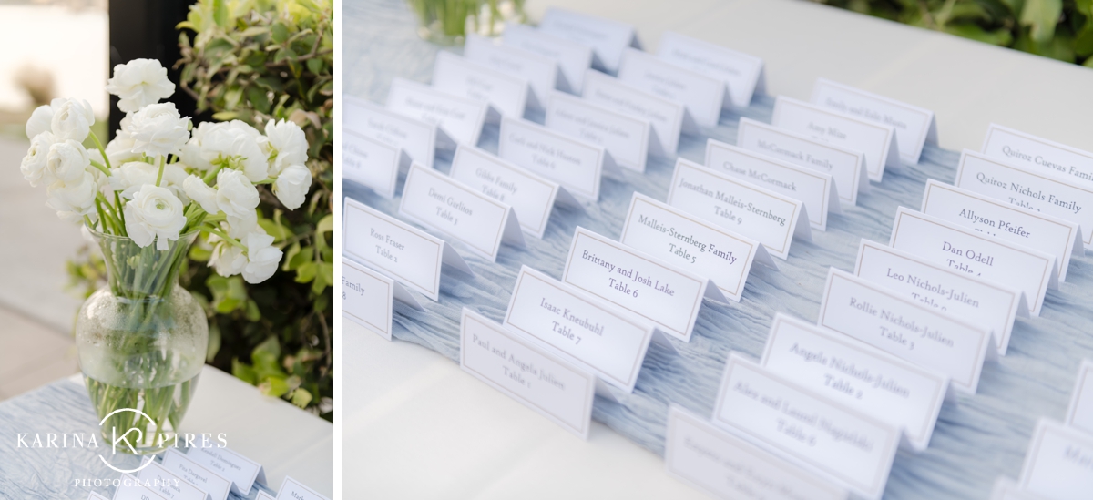 Wedding escort cards on top of a dusty blue gauze runner