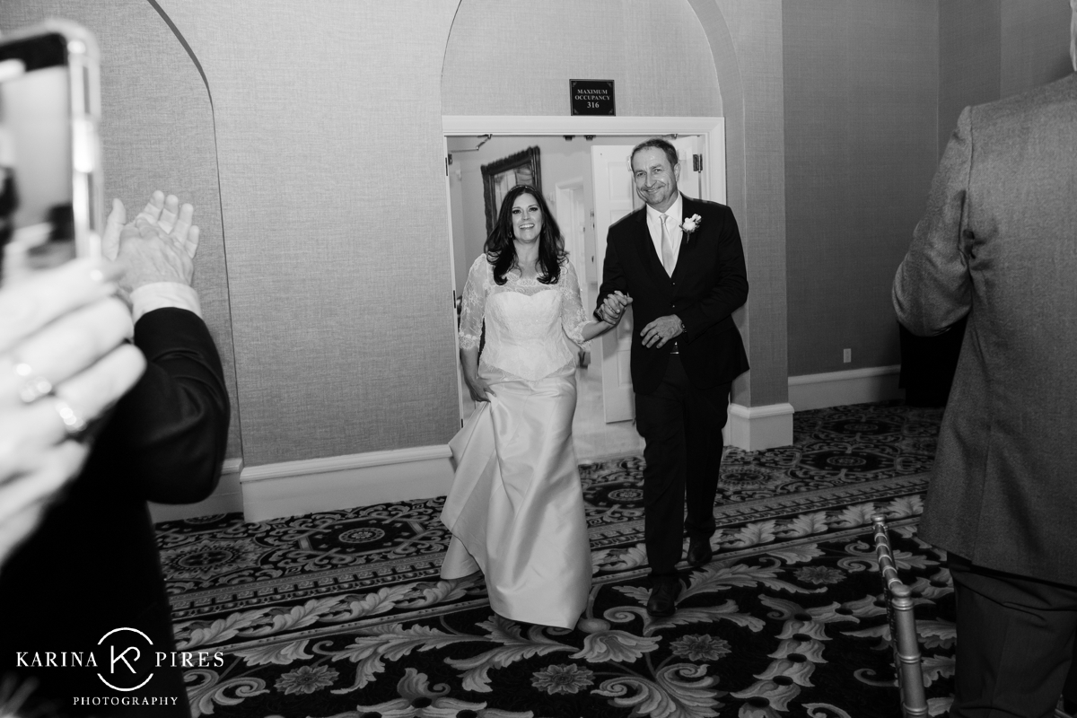 Bride and groom entering their wedding reception at Trump National Golf Club Los Angeles