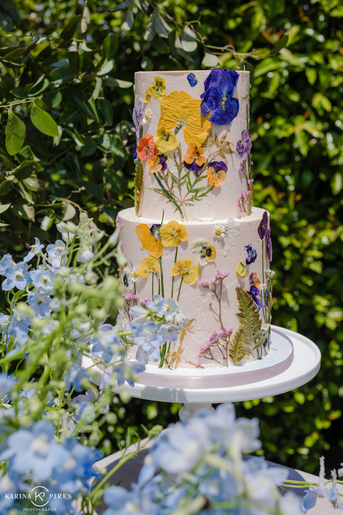 Pressed wildflower layer cake by Peggy Liao for a SoCal gender reveal