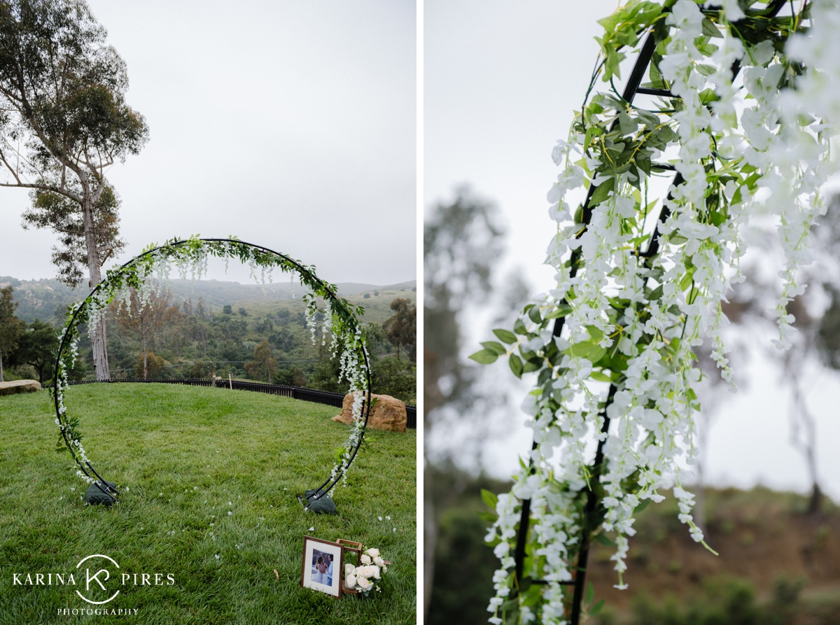 Backyard surprise proposal underneath a floral archway