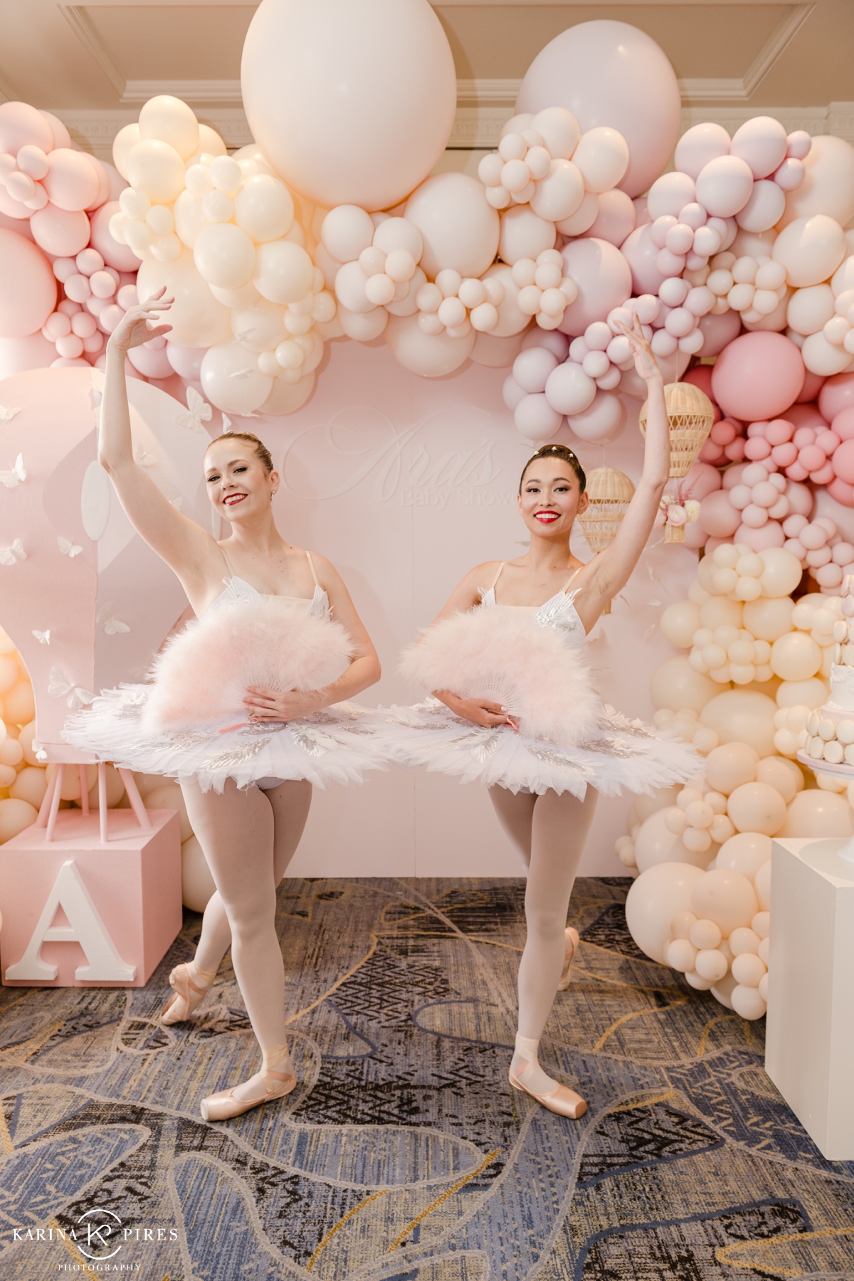 Blush and cream balloon arch for a baby shower