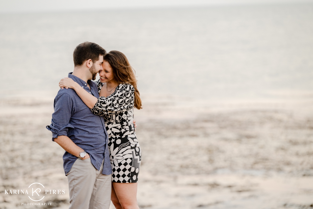 Woman wearing a black and white patterned mini dress for her engagement session