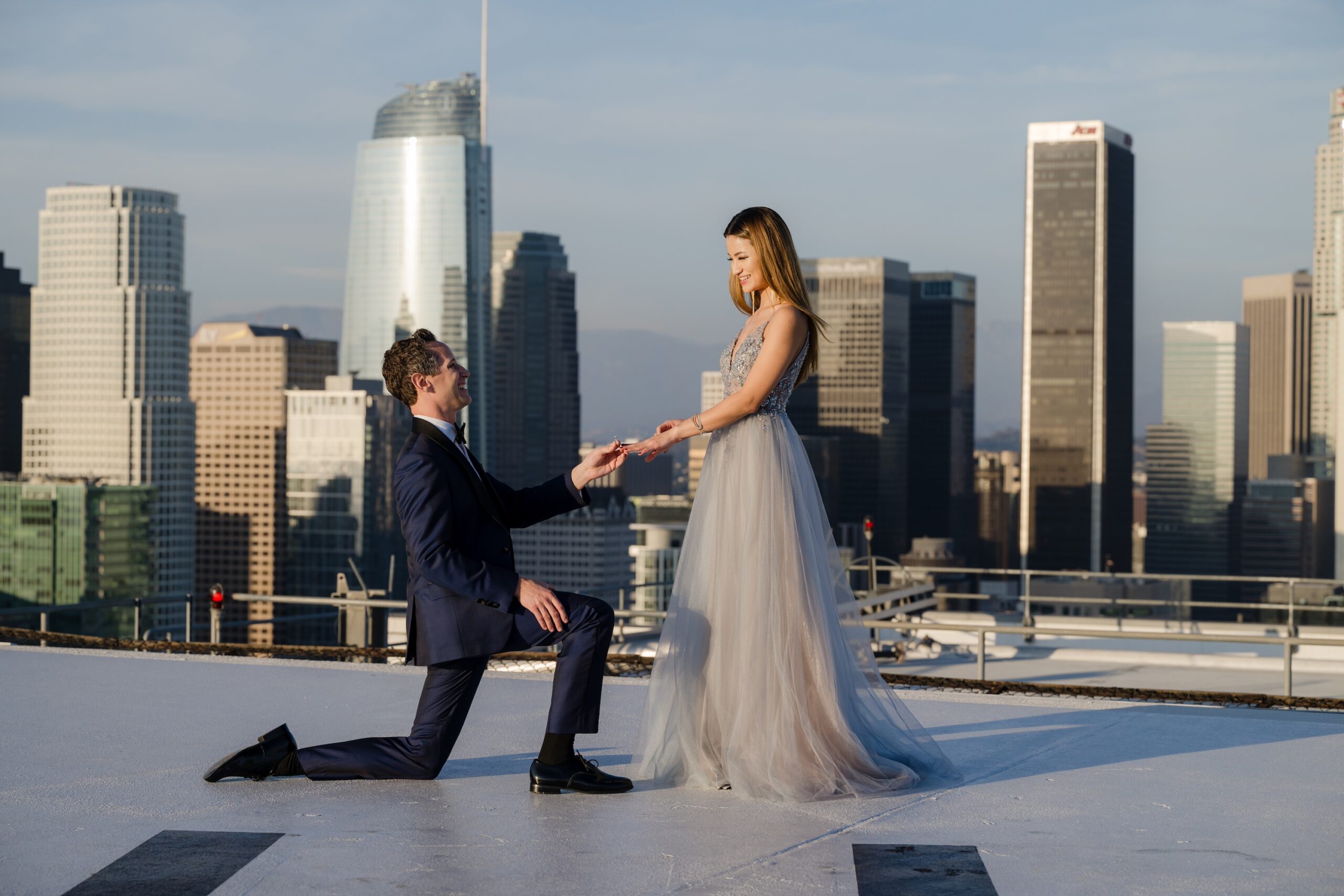 A sunset rooftop proposal in downtown Los Angeles photographed by Karina Pires Photography