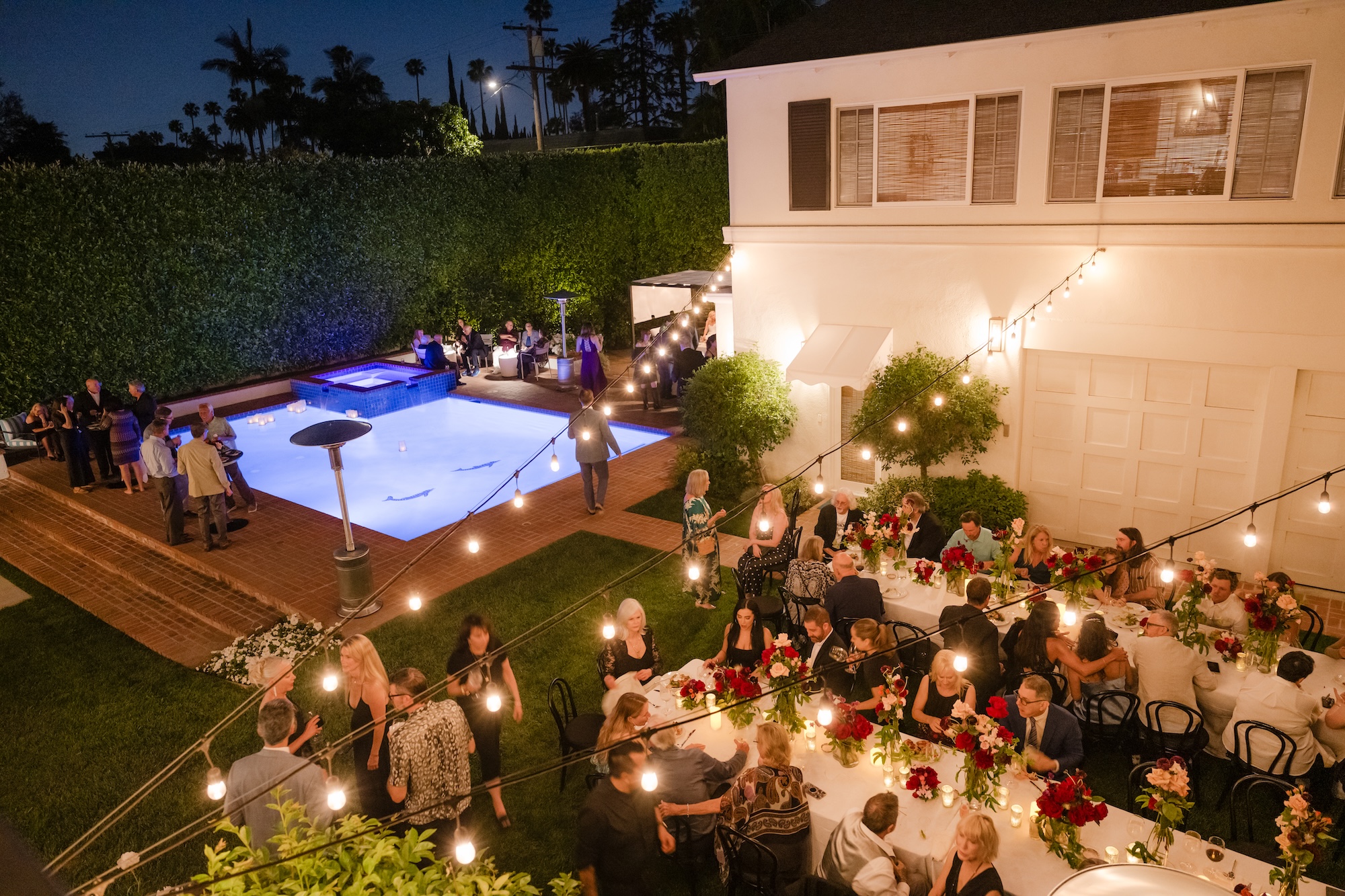 Cafe lights glowing for a backyard wedding reception in Beverly Hills