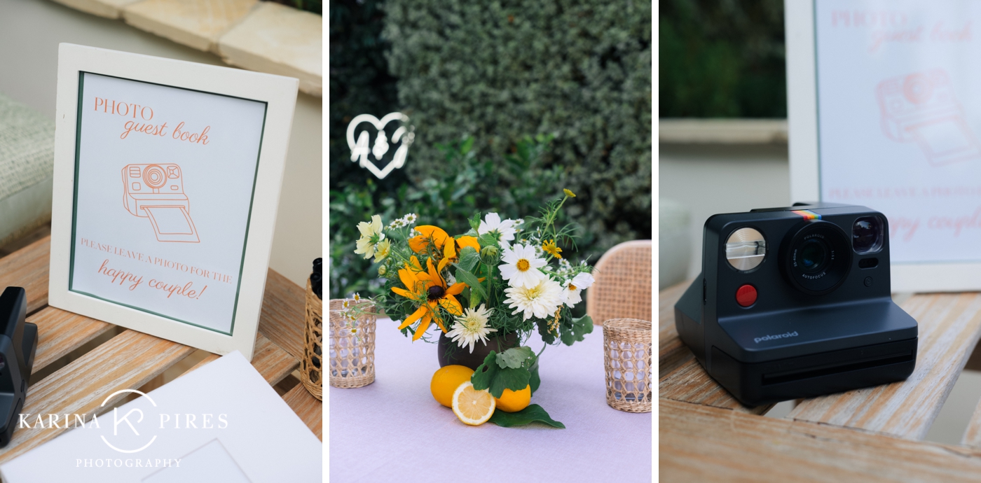 A close-up of yellow and white floral centerpieces with sunflowers, dahlias, and scattered lemons.